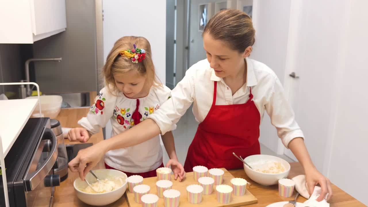Mother and Daughter Baking Cupcakes