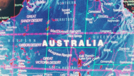 a stylized map of australia showing states, territories, deserts, and major cities