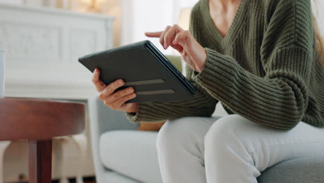 tablet, website browsing and woman on sofa