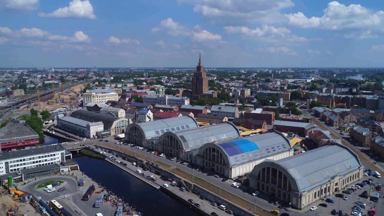 Drone video of Rīga central market pavillions and Latvian Academy of Sciences building - Latvia