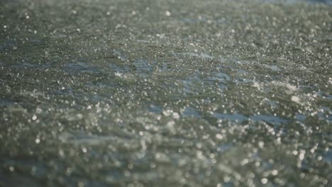 Wavy-Water-Surface-With-Broken-Ice-In-Freezing-River