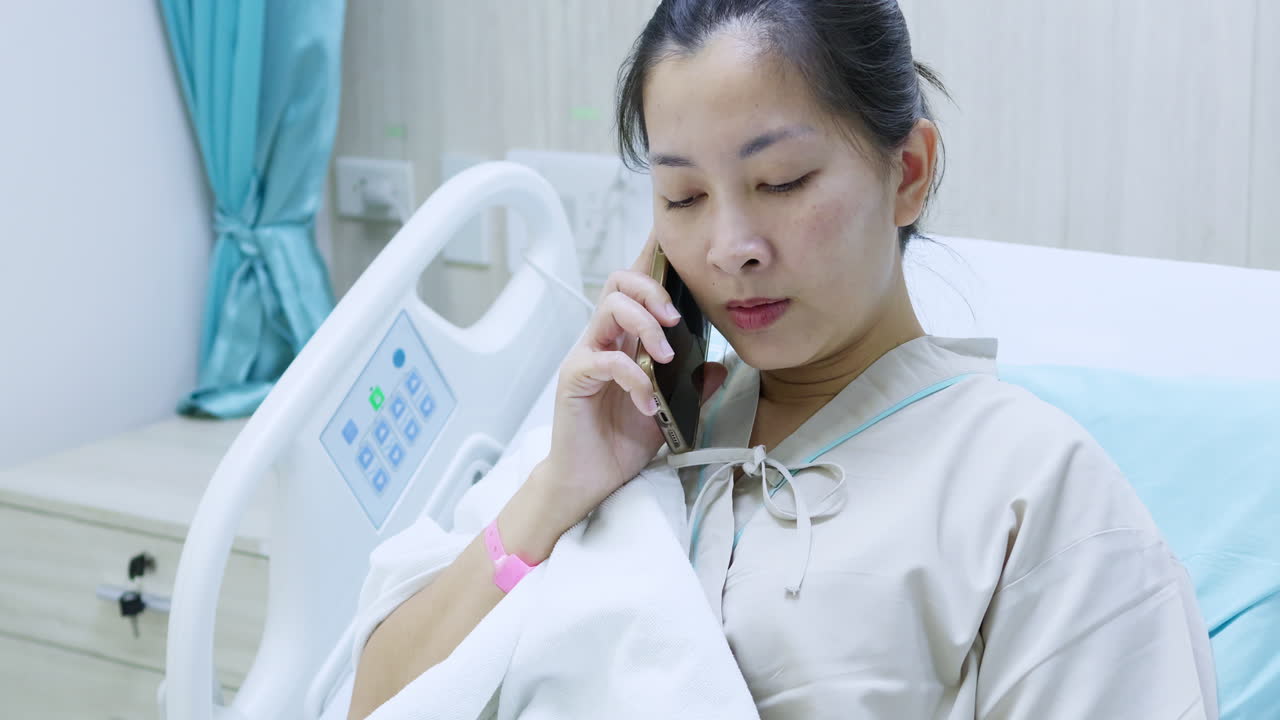 A patient engages in a heartfelt phone call while in a hospital showcasing vulnerability and connection