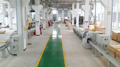 industrial stacks of wood timber for making molds processing, skilled craftsmen and automated machinery create high-quality furniture in a woodworking manufacturing factory environment