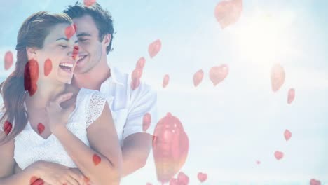Glückliches-Paar,-Das-An-Einem-Sonnigen-Tag-Mit-Einem-Roten-Ballon-Zum-Valentinstag-Kuschelt