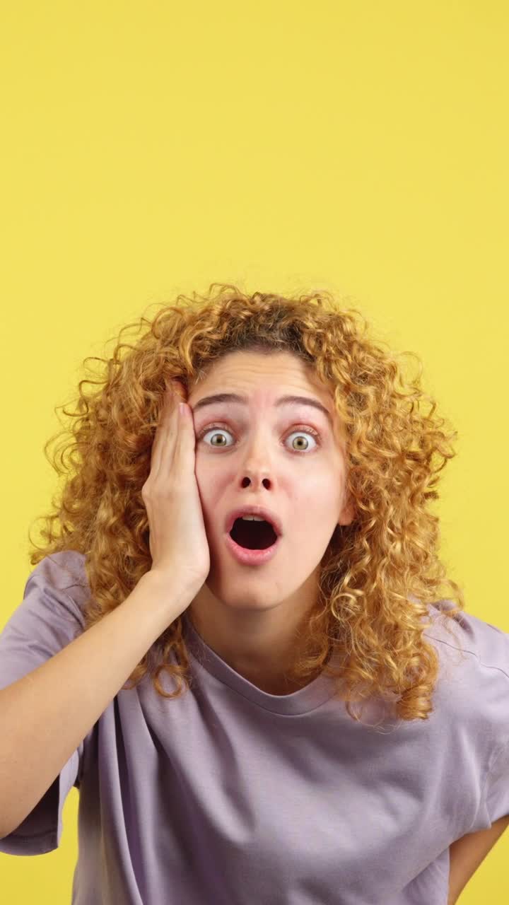 Woman with curly hair showing expressions of shock and surprise