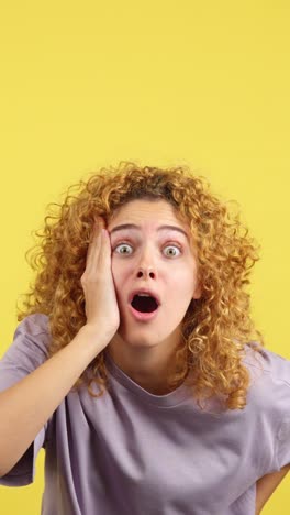 woman with curly hair showing expressions of shock and surprise