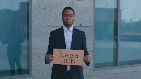 man in business suit seeking employment