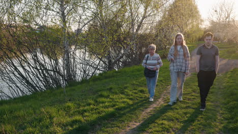 family walk in the park at sunset