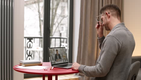 man having video call with colleague
