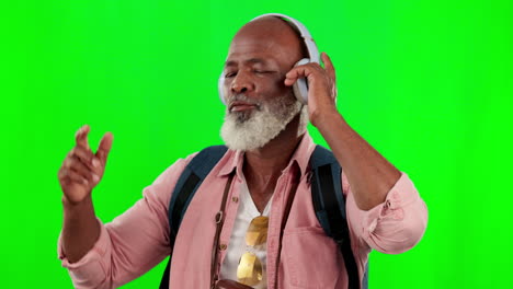 Black-man,-dancing-and-music-headphones-on-green