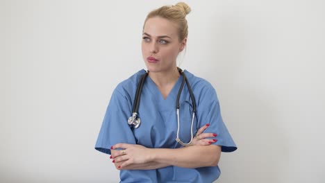 female doctor with closed eyes and crossed arms