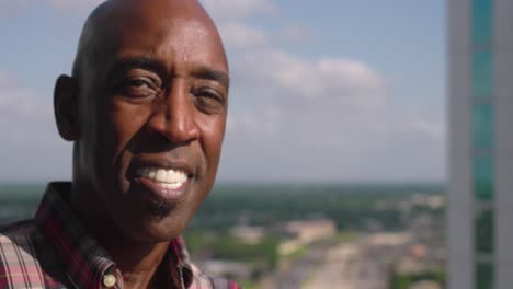 Portrait-view-of-Black-man-smiling-looking-at-camera