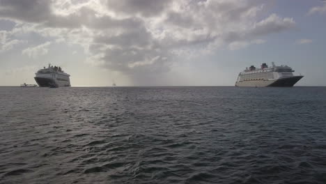 drone shot of 2 cruise ships at port in grand cayman