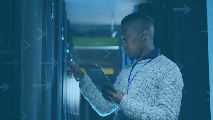 Using tablet, person managing servers in data center environment with animation
