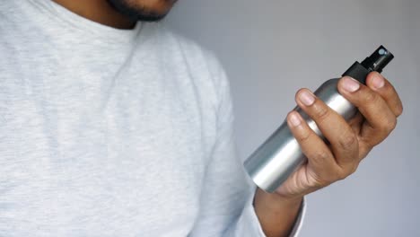 man holding a spray bottle