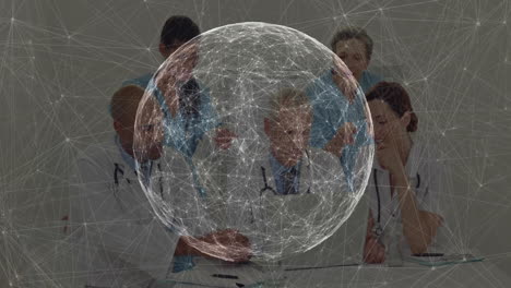 medical team collaborating at meeting table, exploring holographic globe connections over documents