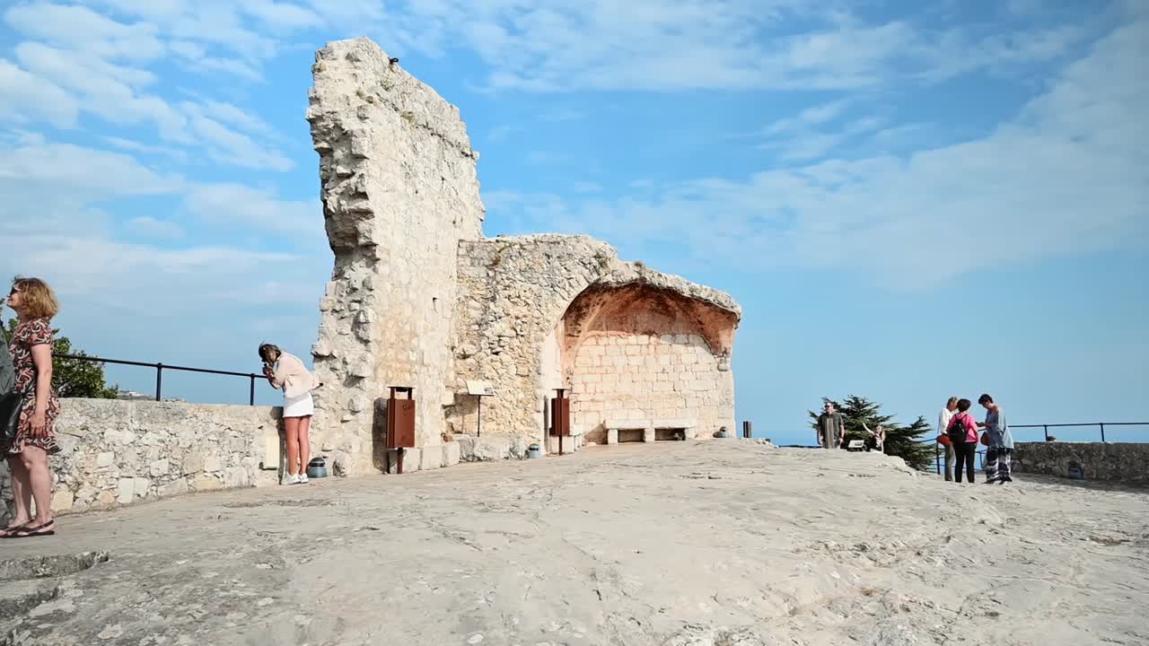 MENTON, FRANCE - SEPTEMBER, 2021: Ancient historical place. Walking people. Slow motion