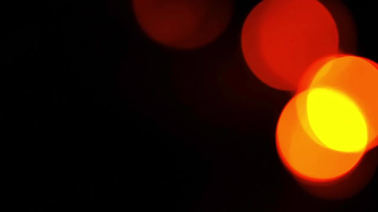Abstract Red and Orange Bokeh Lights on Black Background