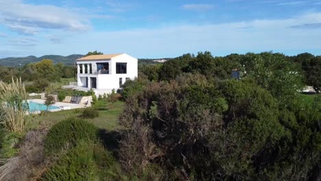 stunning aerial drone flight slowly sinking down drone shot of a villa house with pool on canyon cliff
paradise wild nature dream beach corfu greece autumn 2021