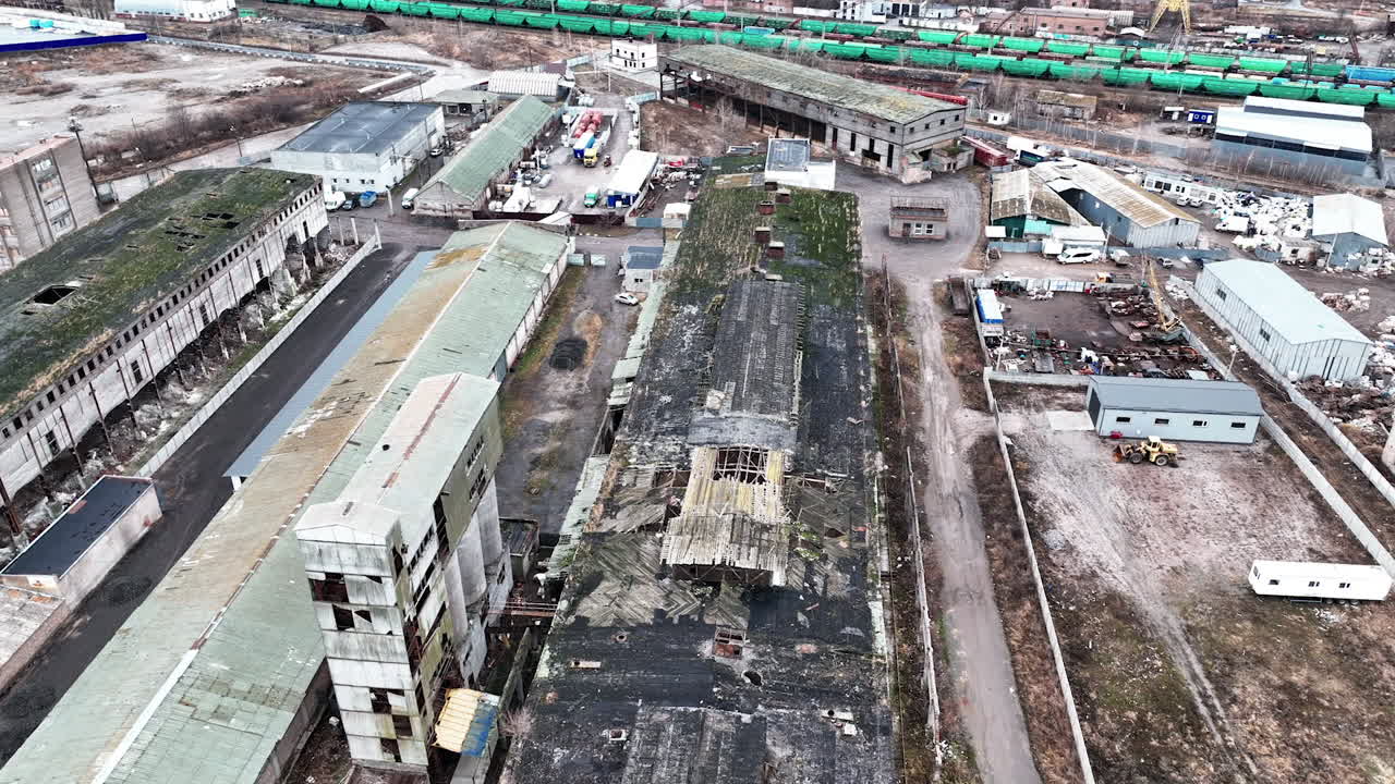 Desolate industrial area with old plant constructions. Large plant territory devastated by time. Aerial view.