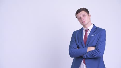 happy young handsome businessman in suit