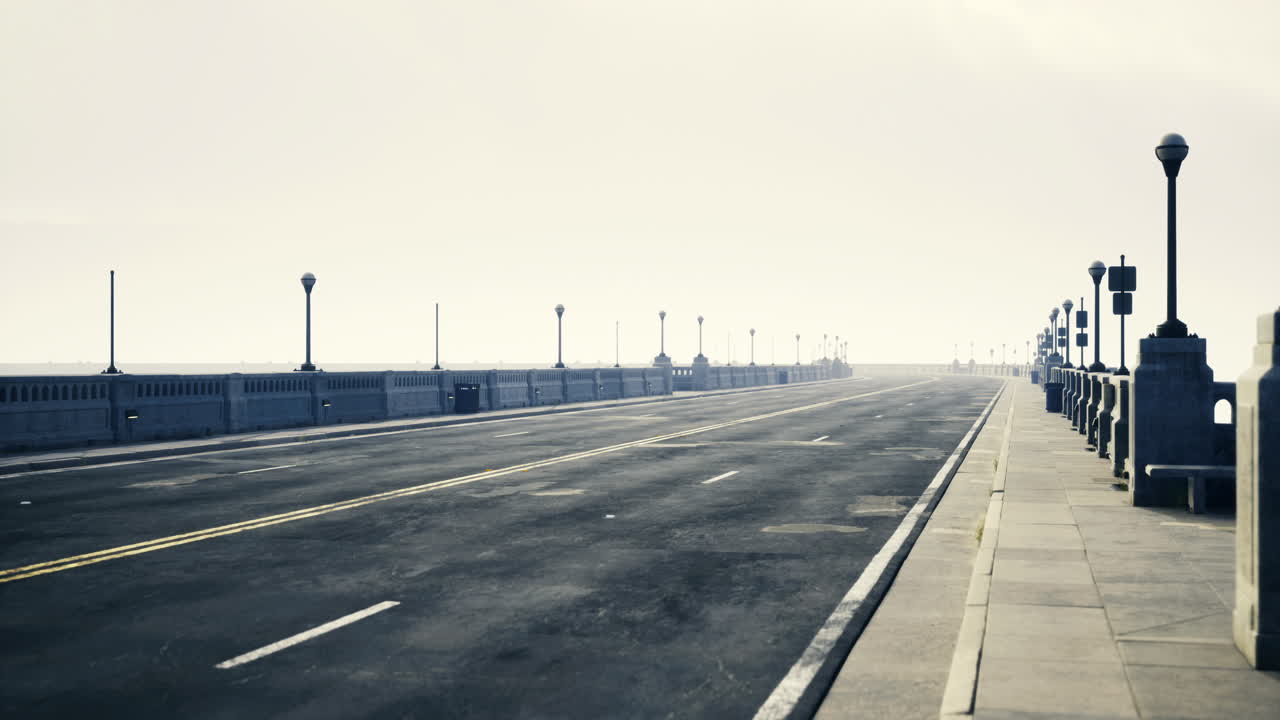 Quiet walkway along a foggy oceanfront under muted sky