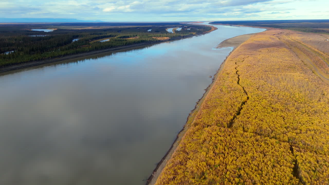 Autumnal Forests On Peel River Near Fort McPherson Village In Northwest Territories, Canada. Aerial Shot