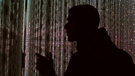 young white guy at teamlab borderless lights museum in tokyo, japan