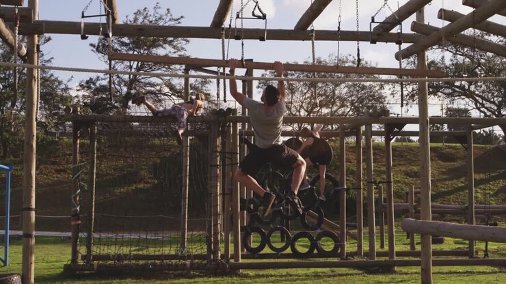 Young adults training at an outdoor gym bootcamp