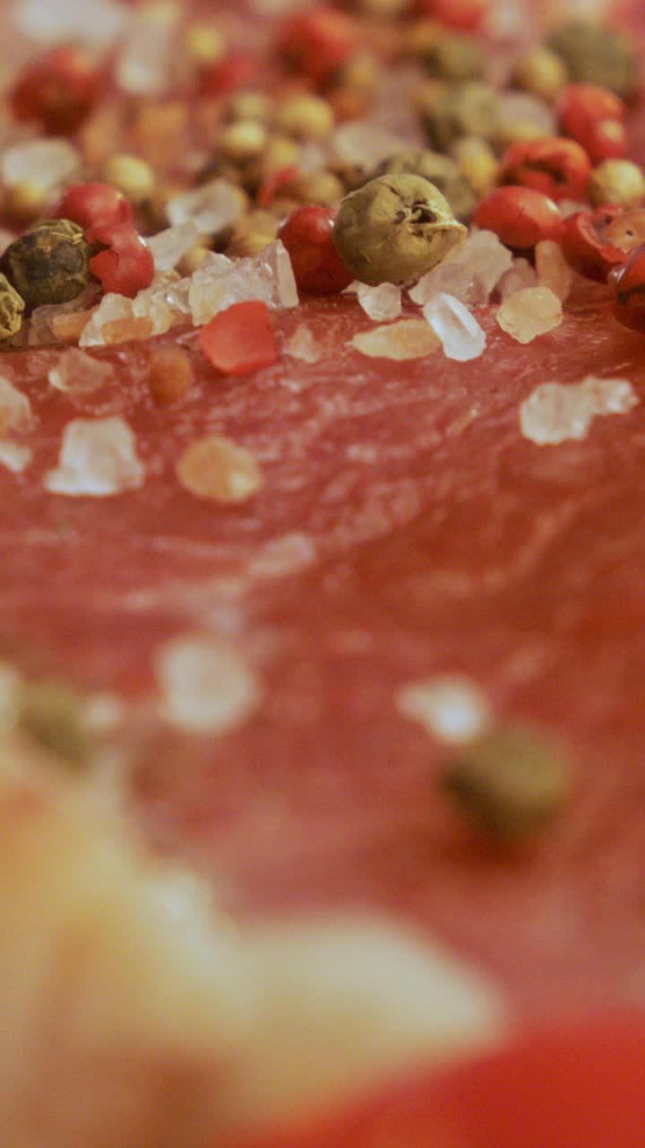 Close-up of meat with pepper and salt
