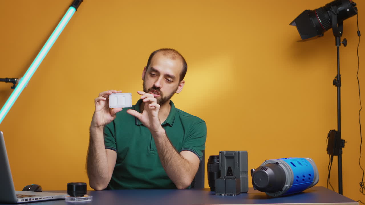 Videographer reviewing mini led led