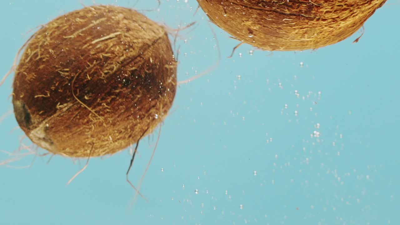 Coconuts Splashing Underwater