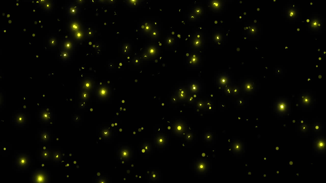 Animazione di punti luminosi di luce gialla su sfondo nero