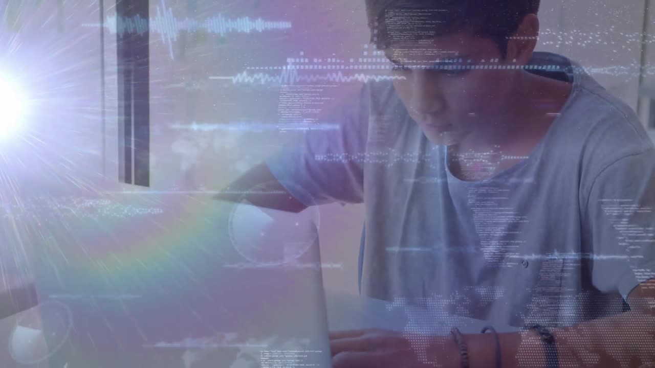 animación de luces sobre un adolescente caucásico usando una computadora