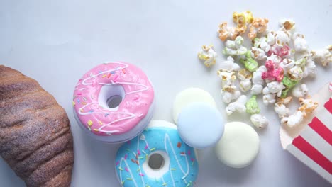 colorful donuts, popcorn, and macarons