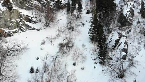 Drone-footage-in-snowy-mountains-as-sun-goes-down