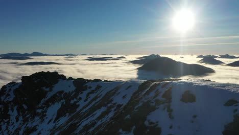 mountain ridge with cloud inversion on gleouraich, munro-bagging in scotland, highlands