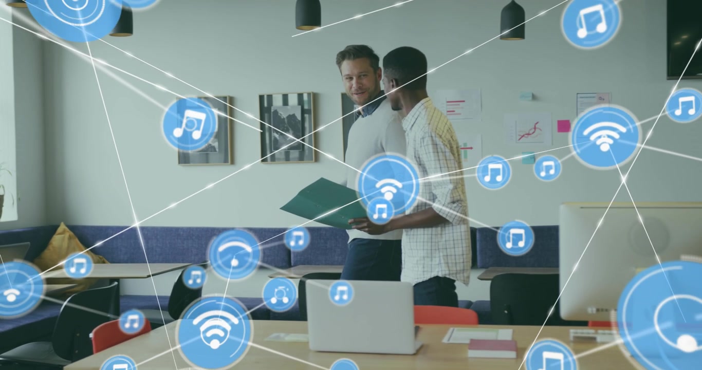 Animation of connected icons over diverse coworkers discussing reports while walking in office