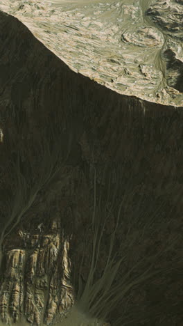 aerial view of a mountain range with a dry riverbed