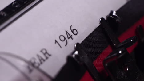 Year-1946,-Typing-on-White-Paper-in-Vintage-Typewriter,-Close-Up