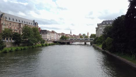 beautiful strasbourg city center with colorful flowers and rhine river