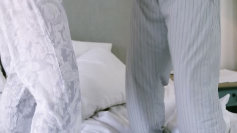 Senior-couple-dancing-on-bed