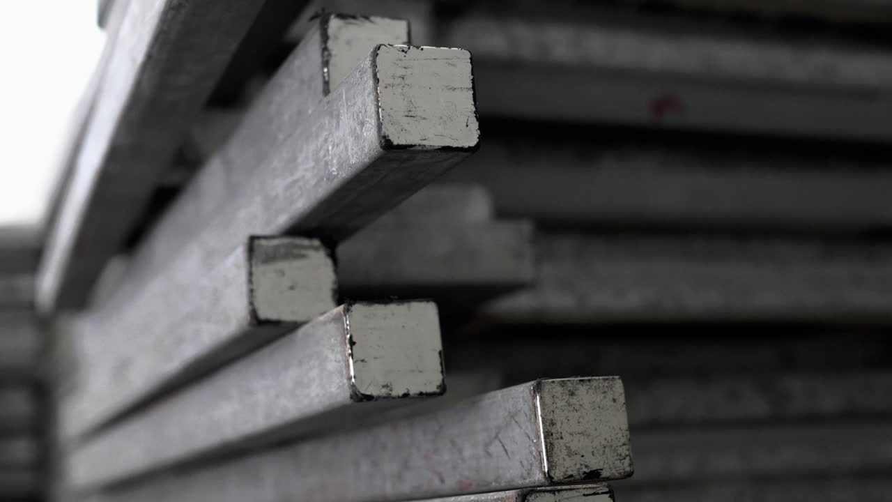 Metal recyclables are neatly arranged. Appearance is old. Tilt shot from top to bottom.