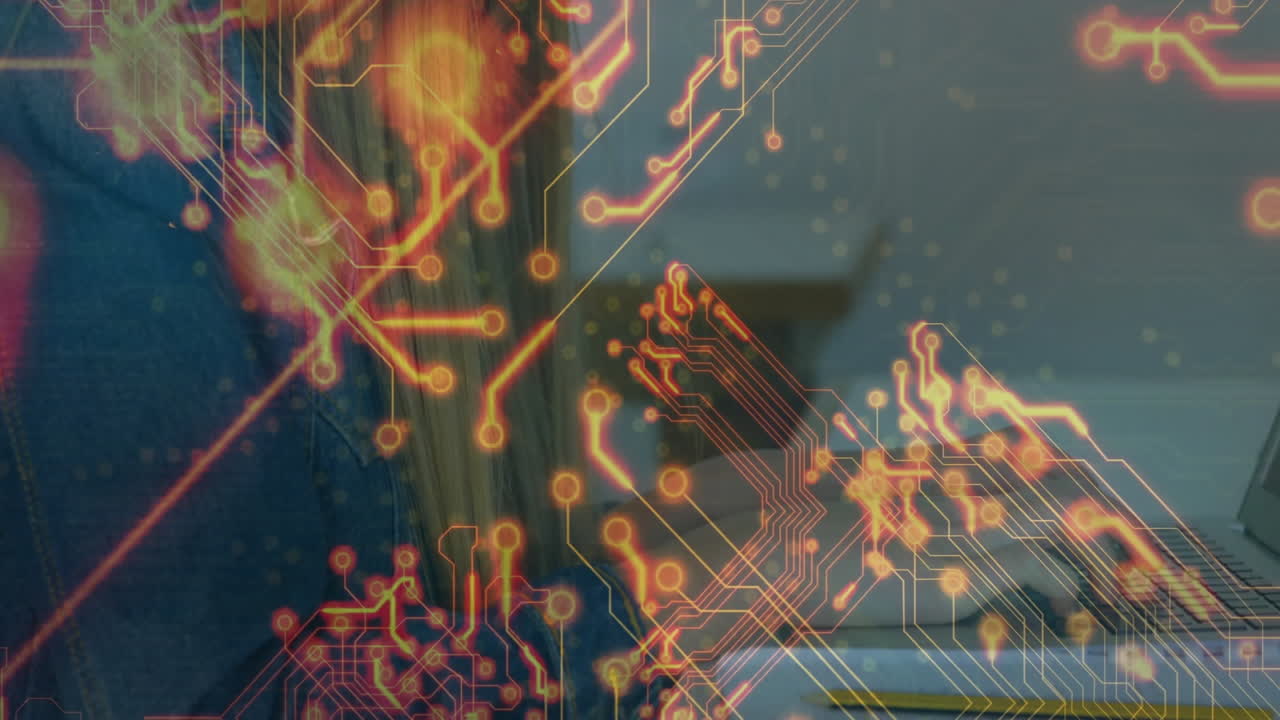 Female student typing on laptop at desk, showcasing glowing circuit graphics for technology