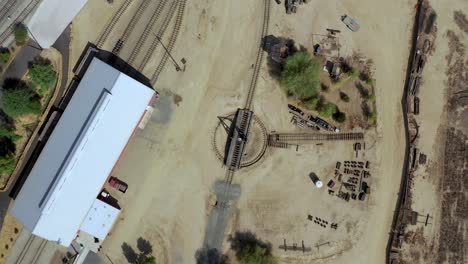 Drone-footage-of-a-old-train-turnstile-from-straight-above