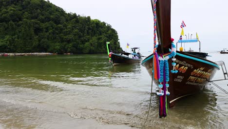 boat approaching shore in krabi, thailand