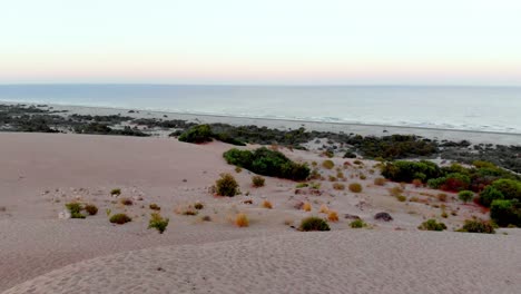 Aerial-to-sea-shooting-with-drone-at-the-point-where-the-desert-meets-the-sea-in-Turkey-Antalya