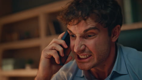 annoyed director arguing smartphone call dissatisfied failure evening close up.