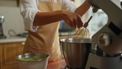 woman baking with matcha in her kitchen