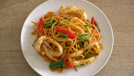 stir-fried spaghetti with salted egg and squid - fusion food style